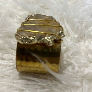 Handmade gold hammered cuff with natural stone and gold foil edges.
